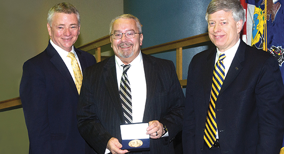 Jerome Cochran received the University’s 225th Anniversary Medallion during a Feb. 22, 2013, meeting of Pitt’s Board of Trustees. From left, Pitt Board Chair Stephen Tritch, Cochran, and, now Chancellor Emeritus Mark A. Nordenberg.