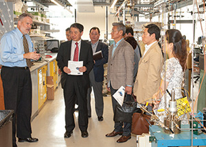 Don Shields (left) leads a Pohang University delegation of academic and industry leaders on a tour of the Center for Energy labs in the Swanson School.