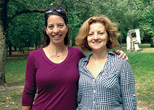 Sara Goodkind, left, meets with Raluca Filipache in Buzua, Romania, in 2015. Filipache, now a high school English teacher, participated in Goodkind’s first camp for female leadership. 