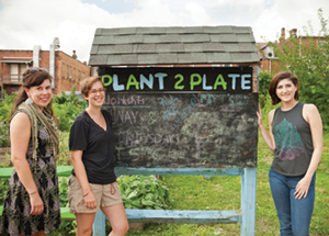 Pitt’s Plant to Plate student organization manages an urban garden at the corner of Oakland Avenue and Sennott Street in Oakland. The garden’s vegetables and fruits are donated to local food pantries. From left, Erika Ninos, sustainability program coordinator, Office of PittServes; Holly Giovengo (A&S ’15), who was a student leader in sustainability initiatives on campus while an undergraduate and an AmeriCorps VISTA volunteer last year; and Alyssa Martinec, the student sustainability intern for Pitt’s Department of Housing who is active in Pitt’s Take Back the Tap initiative. (Photo by Emily O'Donnell)
