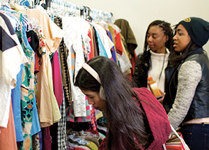 Shoppers peruse clothing in Thriftsburgh. (Photo by Emily O'Donnell)