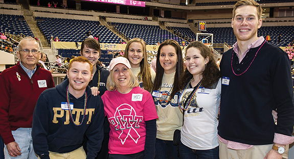 Members of Pitt’s Student Alumni Association and the Pitt Alumni Association gathered at the Petersen Events Center on Jan. 24 for dinner in a courtside suite during a Pitt women’s basketball game. The event was part of the Student Alumni Association’s Dinner with 12 Panthers program, an annual mentoring initiative that pairs students with alumni who host meals and other events. This year, more than 40 alumni hosted 22 events for Student Alumni Association members, including home-cooked meals at alumni homes and lunches at Downtown restaurants. Alumnus Dave Lower organized the lunch at the Petersen. In front row, from left, are Dustin Herbert and Maureen McBride. In back row, from left, are Richard Kowal (A&S ’74, GSPIA ’76), Kerry Iles, Courtney Bruch, Amanda Monaco, Remi Nuddle, and Greg Kunis. 
