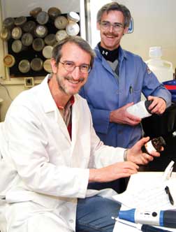 Jeffrey Brodsky, the Avinoff Professor of Biological Sciences (seated), and Peter Wipf, Distinguished University Professor in the Department of Chemistry, are collaborating on a project to search for potential therapeutic agents that inhibit the growth of cancer cells, thwart the replication of specific pathogens, and repair defects in cellular protein folding processes.