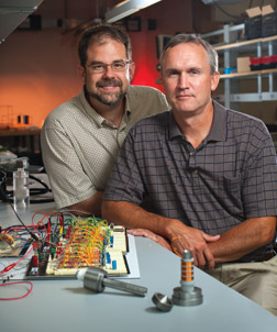 William “Buddy” Clark (right) and Jeff Vipperman, both Pitt professors of mechanical engineering and materials science, were asked by the National Energy Technology Lab (NETL) to develop a valve system for power plant gas turbines that would decrease emissions, control combustion instabilities, and provide fuel flexibility, allowing the turbines to burn conventional fuels such as methane as well as gases derived from coal, hydrogen, petrochemicals, cow manure, and other sources. Clark and Vipperman’s research yielded a set of valves that could rapidly adjust fuel flow rate based on information obtained from a combustion sensor developed by NETL, Clark says. The research team now is working with Pitt’s Office of Technology Management, along with NETL, to commercialize the innovation.