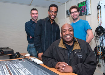  Three Pitt jazz students—the first to be seeking degrees in Pitt’s new PhD curriculum in jazz studies—made presentations April 26 in their Advanced Jazz Composition course in Pitt’s William R. Robinson Recording Studio in Bellefield Hall. Seated is Nathan Davis, Pitt’s director of Jazz Studies, and students (from left) James Moore, Alton Merrell, and Nathan Frink. Each student presented a fully completed score of an extended concert jazz work, a jazz ballet, a jazz musical theater piece or a mini opera, and a score for a film chosen by the composer. Davis developed the new jazz PhD program, which combines musicology, ethnomusicology, composition, and performance.  