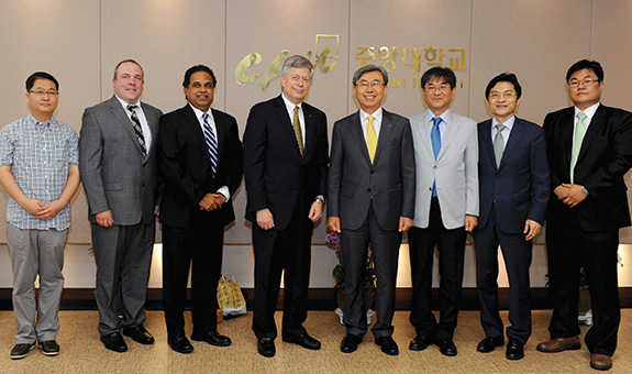 Pitt’s Korea delegation stands with Chung-Ang University’s President Lee and three top university officials, including one Pitt alumnus. From left, Pitt’s Jeong; Kane; Shroff; and Chancellor Nordenberg; Chung-Ang University’s President Lee; Yun Gyeon-Hyeon, vice president for natural sciences and engineering; Hong Jun Hyun (GSPIA ’95), dean of international affairs; and Lee Dong-Hyun, professor of integrative engineering.